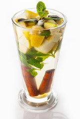 Tea with cinnamon, flowers and fruits