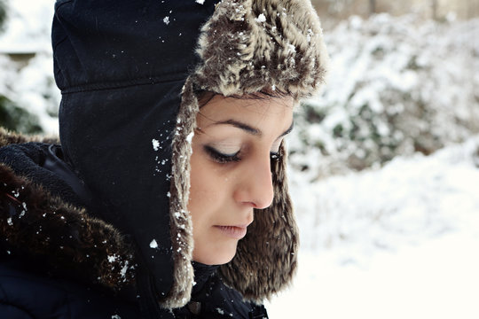 Pretty young woman with winter hat, outside portrait