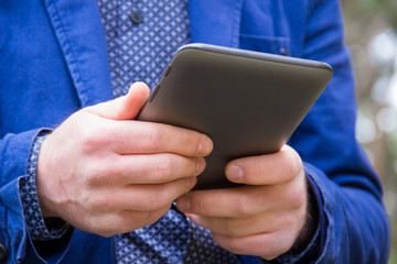 Man holding tablet in hand