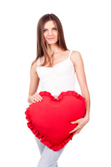 Young woman holding a red heart