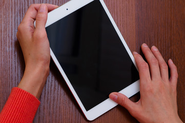 Female hands holding generic tablet
