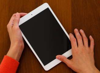 Female hands holding generic tablet