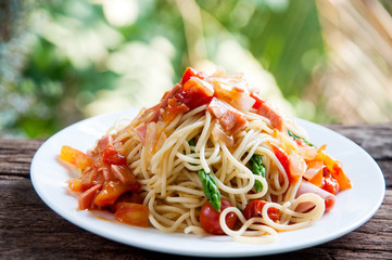 Spagetti with tomato suace on white plate