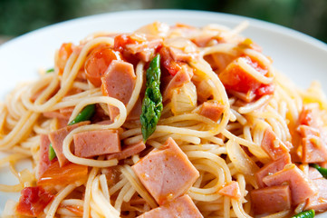 Spagetti with tomato suace on white plate