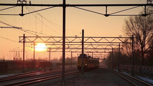 Train riding during a nice, winter sunrise.