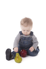 Fototapeta premium Baby girl in overalls