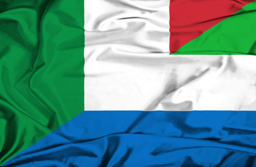 Waving flag of Sierra Leone and Italy