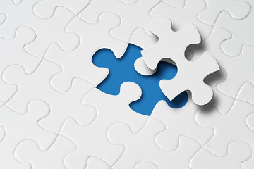 Missing jigsaw puzzle piece with light glow, business concept