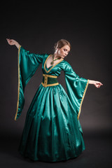 Portrait of the elegant woman in medieval era dress.