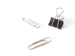 Black paperclips on a white background.