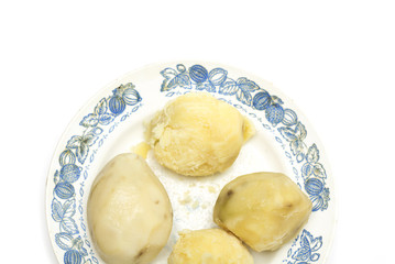 Boiled potatoes on a plate. Photo.
