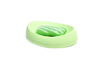 Green soap in the soap dish. Photo.