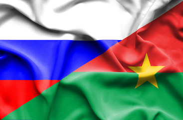Waving flag of Burkina Faso and Russia