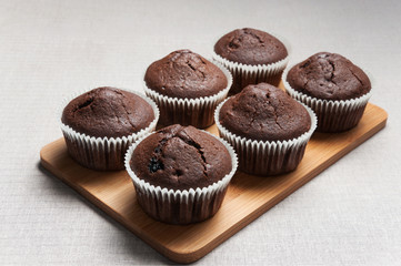 Chocolate muffins on the cutting board