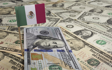 Flag of Mexico sticking in various american banknotes.(series)
