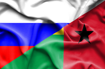 Waving flag of Guinea Bissau and Russia