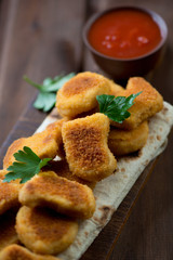 Freshly made chicken nuggets, close-up, selective focus