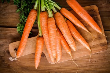 fresh carrots bunch on cutting board