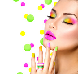 Beauty girl with colorful makeup, nail polish and accessories