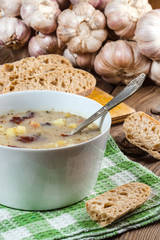 Sour soup with bread.