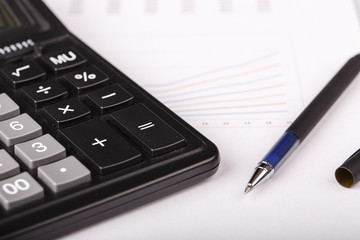 Business Charts with calculator and pen