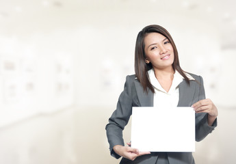 Portrait asia business woman 20 - 30 year old hold banner