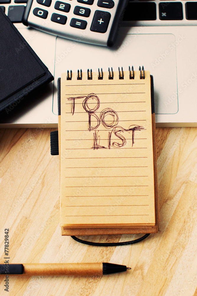 Poster a to do list in a yellow sheet notebook