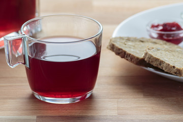 Strawberry tea, strawberry jam, butter and rye bread