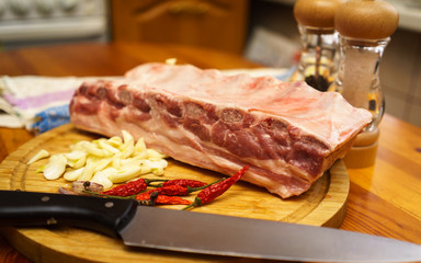 Fresh pork ribs, meat marinated and prepared for roast