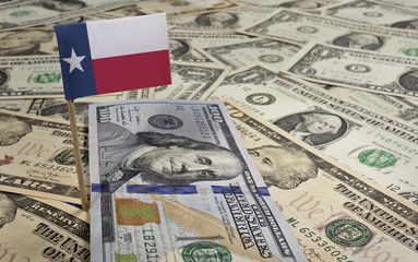 Flag of Texas sticking in various american banknotes.(series)