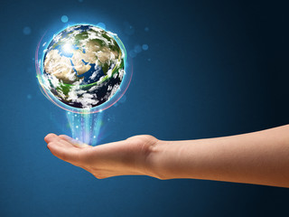 Woman holding a glowing earth globe