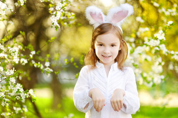 Adorable little girl wearing bunny ears on Easter © MNStudio