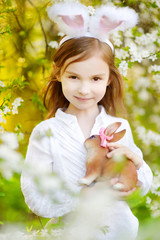 Adorable little girl wearing bunny ears on Easter © MNStudio