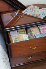 Bundles of banknotes in bedside table