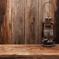 lamp oil lantern retro barn wooden background