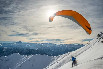 Papier Peint photo Sports aériens Paraglider launching from snowy slope