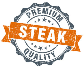 Obraz premium steak vintage orange seal isolated on white