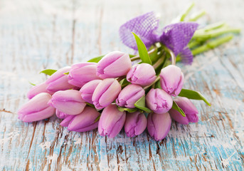 Pink tulips on wooden planks