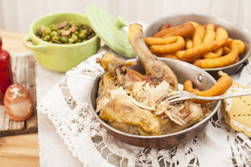 Roast chicken with potatoes chifeletti.