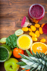 Blended green,yellow and purple smoothie with ingredients select