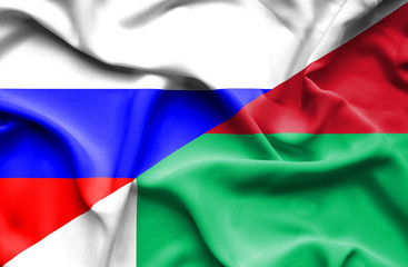 Waving flag of Madagascar and Russia