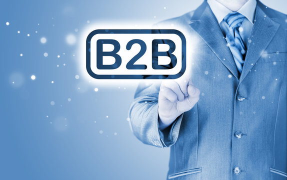 businessman pointing to word B2B, business-to-busines s, written