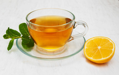 Cup of tea with lemon and mint