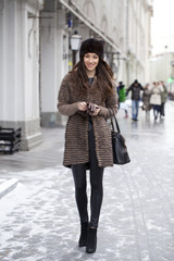 Obraz premium Young beautiful woman in stylish mink coat