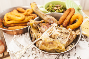 Roast chicken with potatoes chifeletti.