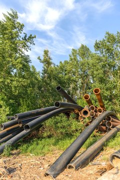 Rusty metal pipes in the forest
