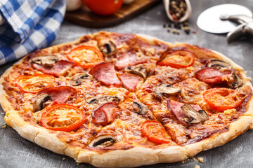 Pizza with ham and mushrooms
