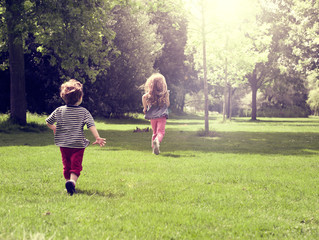 Fototapeta premium Happy children running at mead