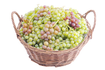 Grapes in a wicker basket. Grapes on a white background.