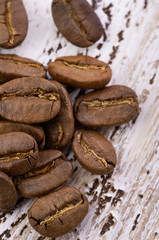 Coffee beans on wood background